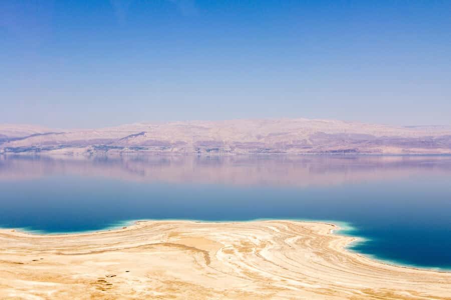 Jerusalem: Masada National Park and Dead Sea Excursion - Walking from the Dead Sea shore toward Masada: the big view moment