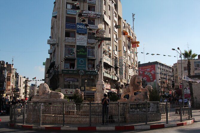 West Bank Tour from Jerusalem - The separation barrier and Banksy graffiti: a hard stop, handled by the guide